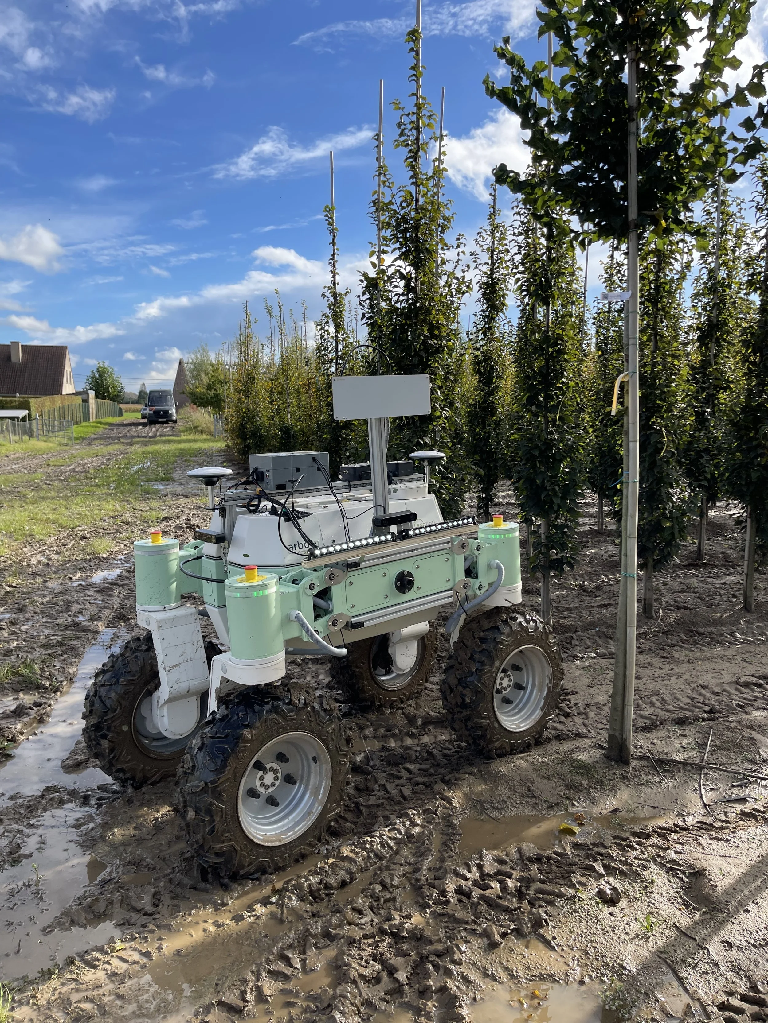 Land-A2 robot carrying the measurement payload between young trees